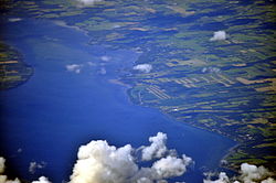 Aerial view of Union Springs from south by southwest, 2013. The village is on the cove of Cayuga Lake just above the center of the photo.