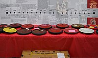 A display showcasing the historical timeline of the Official Soap Box Derby wheels over the years