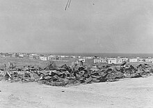 A completely destroyed set of wooden buildings