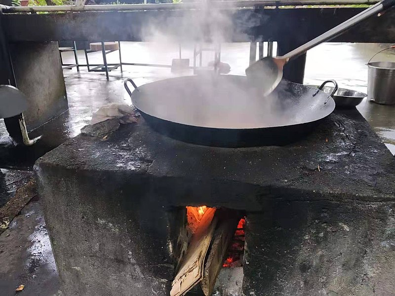 File:Cooking with a wok on an outdoor stove 4.jpg