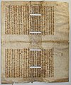 Book cover of manuscript leaf with slits for binding cords