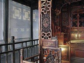 This image demonstrates the openwork carving of a bed frame in Wuzhen