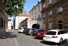 An old European street with parked cars