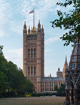 Palace of Westminster Victoria Tower with Victoria Tower Gardens South in the foreground, in evening light.