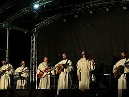 Six members of the band during a concert