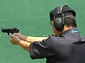 Malaysian policemen aiming the Beretta 92 Compact L for firing