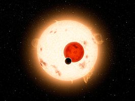 Artistieke impressie van het Kepler-16-stelsel, waarbij Kepler-16b net een overgang maakt vóór A en B.