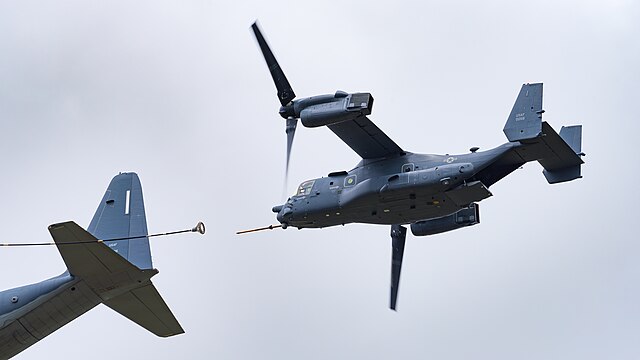 Bell-Boeing CV-22B Osprey of the United States Air Force (reg. 11-0058) following a Lockheed Martin MC-130J Hercules Commando II (reg. 08-6205) mimicking probe-and-drogue refueling at the Royal International Air Tattoo 2023.