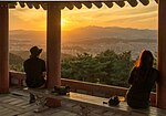 Thumbnail for File:Two people viewing sunset from Bomunsan (mountain) Fortress in Daejeon, Korea.jpg