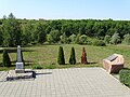 Original Soviet monument (at left) with killing site, Drobytsky Yar