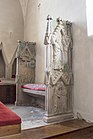 Choir bench made of limestone with still-visible traces of medieval paint, Burs Church, Gotland, Sweden