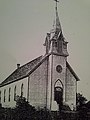 The original wood-frame church in Butler City.