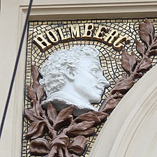 Medallion of Holmberg on the facade of Ateneum by Ville Vallgren, 1887