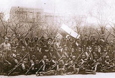 Officers and soldiers of the army of the Azerbaijan Democratic Republic against the background of the state tricolour