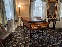 The octagonal drawing room, which has a wooden grand piano