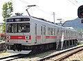 1000 series set 1001 in May 2012. Front designation/service signs shown are from former Tokyu Toyoko line service with through-running to the Tokyo Metro Hibiya Line.