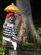 Balinese sculpture with umbrella