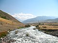 The Aq-Suu river flowing from the Narzan valley into the south end of Jardy-Suu village.