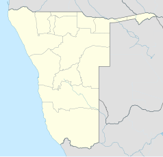 Mapa konturowa Namibii, blisko centrum na lewo znajduje się punkt z opisem „Okahandja”