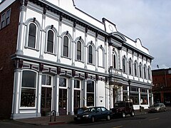 Second Empire Independent Order of Odd Fellows Hall building with original commercial space on the first floor.