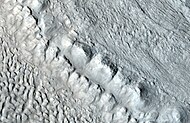 Enlargement of area in rectangle of the previous image. On Earth the ridge would be called the terminal moraine of an alpine glacier. Picture taken with HiRISE under the HiWish program.