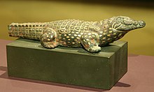 Bronze statue of a crocodile inlaid with gold