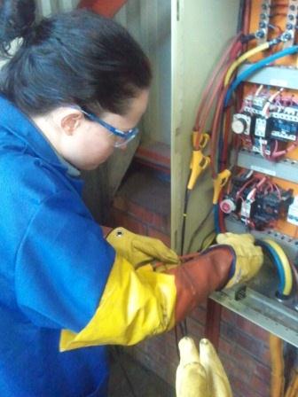 File:Energy Auditor connecting a power logger to a distribution board.jpg