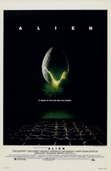 A large egg-shaped object that is cracked and emits a yellowish light hovers in mid-air against a black background and above a waffle-like floor. The title "ALIEN" appears in block letters above the egg, and just below it, the tagline appears in smaller type: "In space no one can hear you scream."