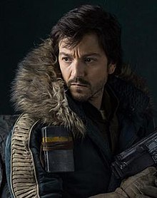 Cassian wielding a blaster in Rogue One (2016).