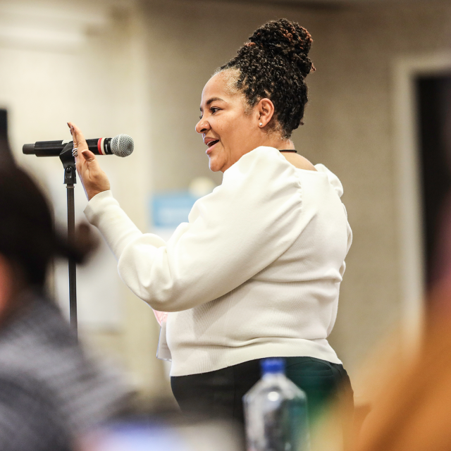 Woman speaking at microphone