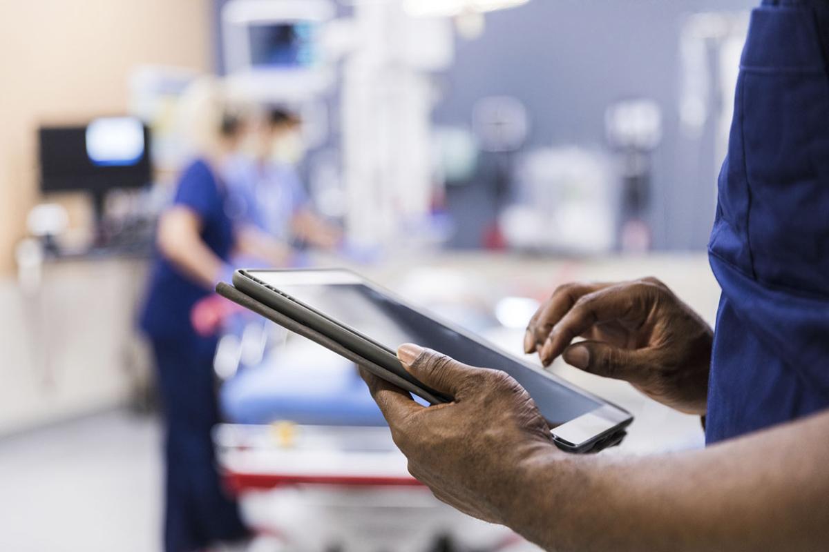 Person using tablet in hospital room