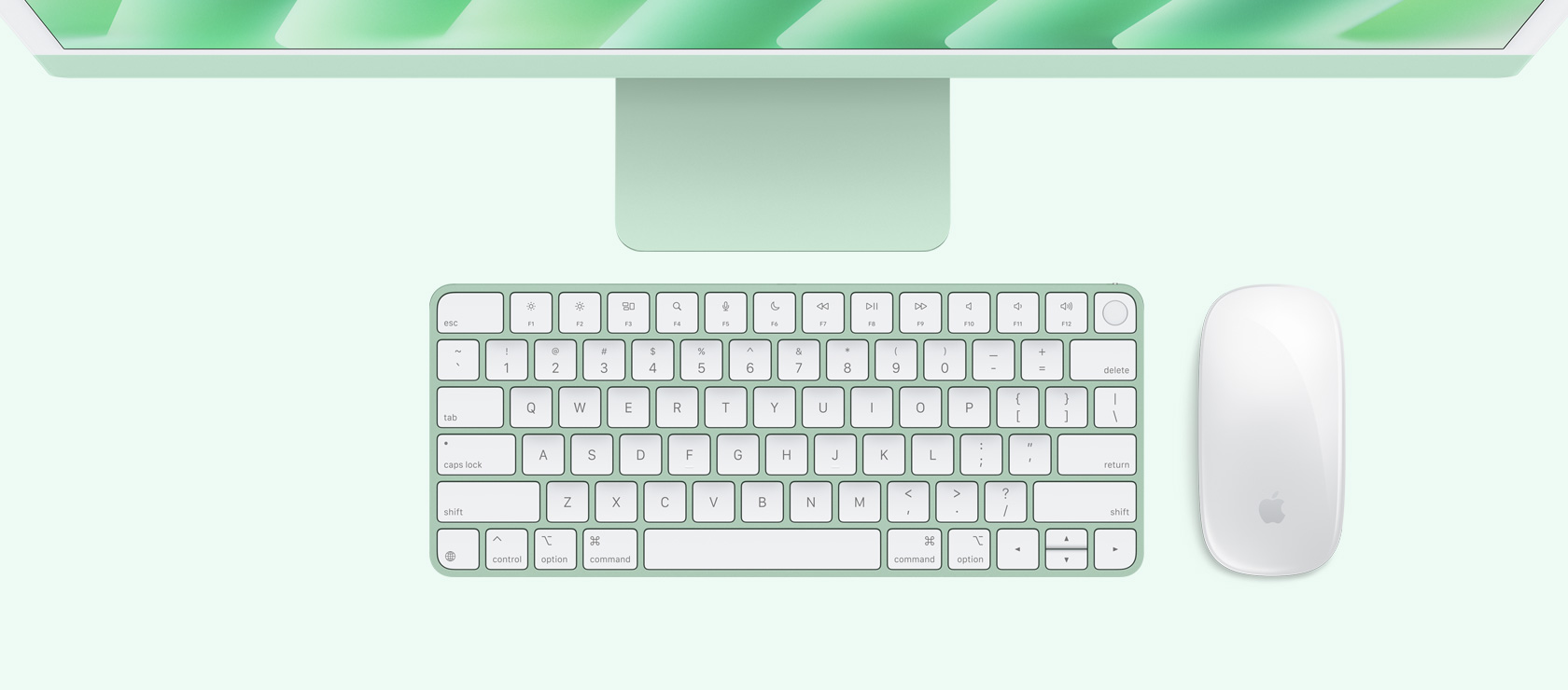 Overhead view of a green iMac with colour-matching mouse and keyboard