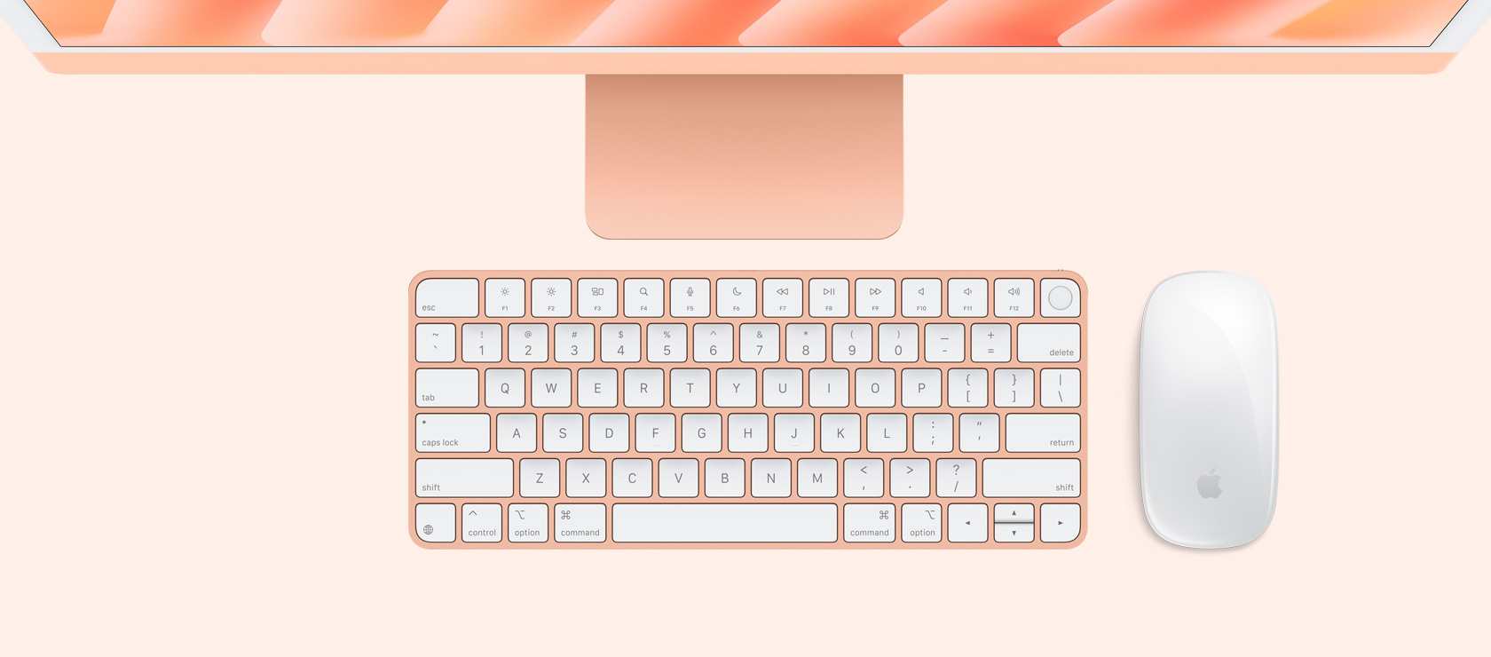 Overhead view of orange iMac with colour-matching mouse and keyboard