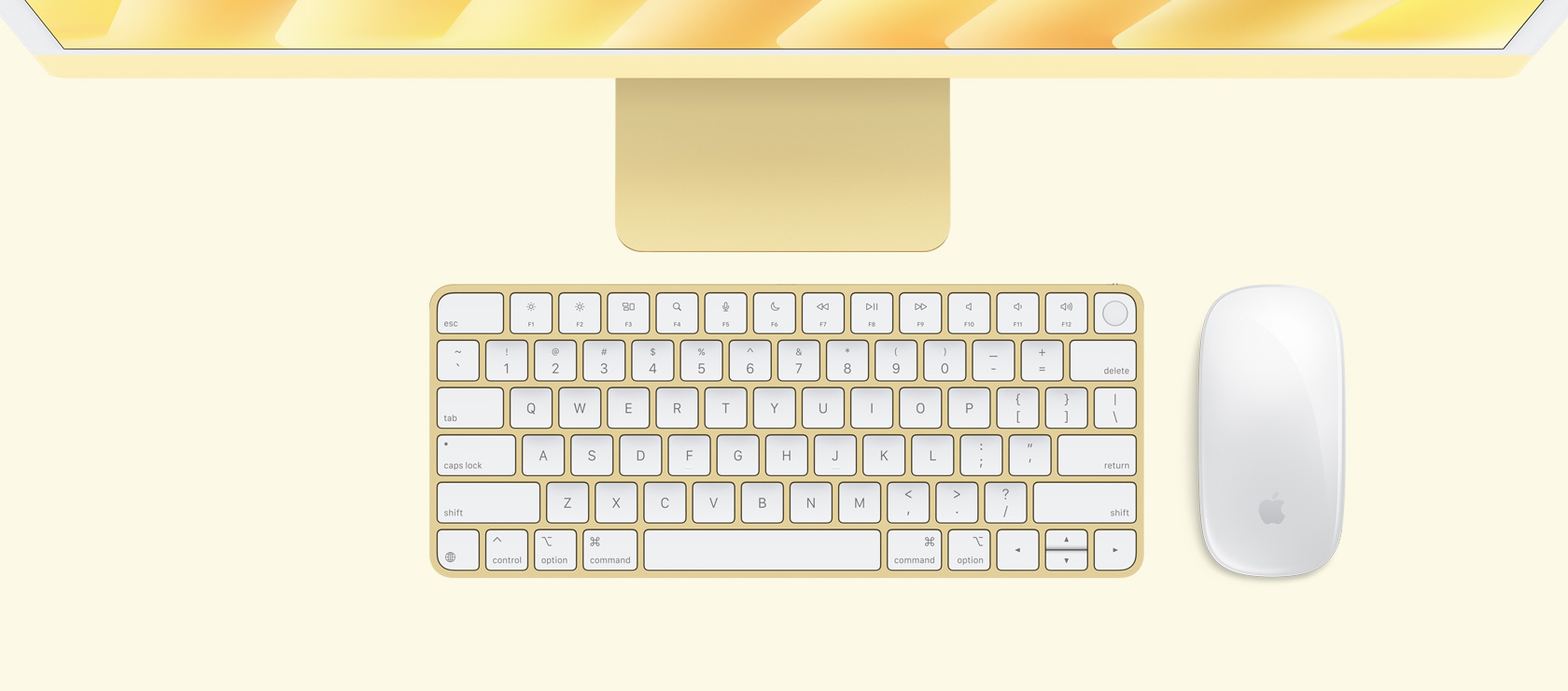 Overhead view of a yellow iMac with colour-matching mouse and keyboard