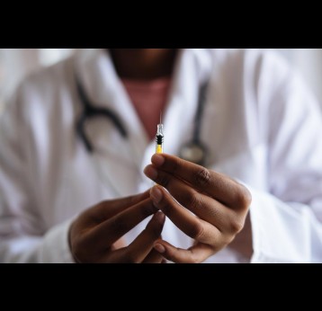 A doctor holding a prepared shot of vaccine. Credit: RF._.studio on Pexels