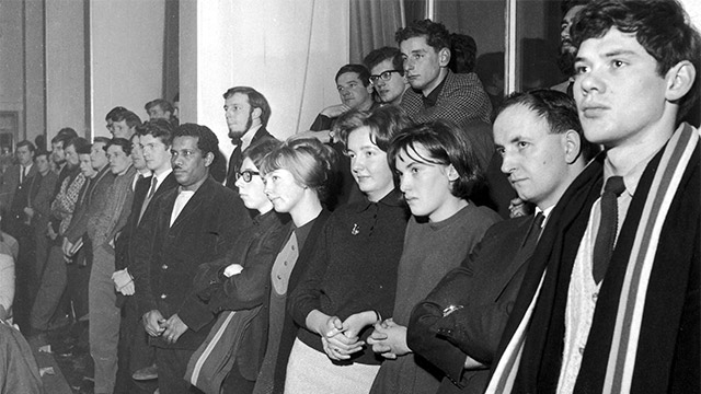 A group of students watch the Royal Charter award ceremony