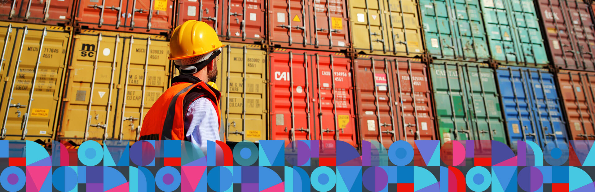 A dock worker with a laptop taking a stock of container boxes