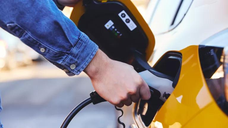 A person charging their electric car.