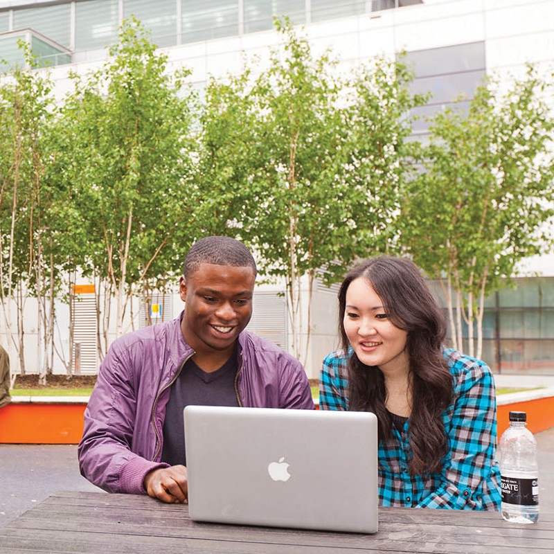 Two students on laptop