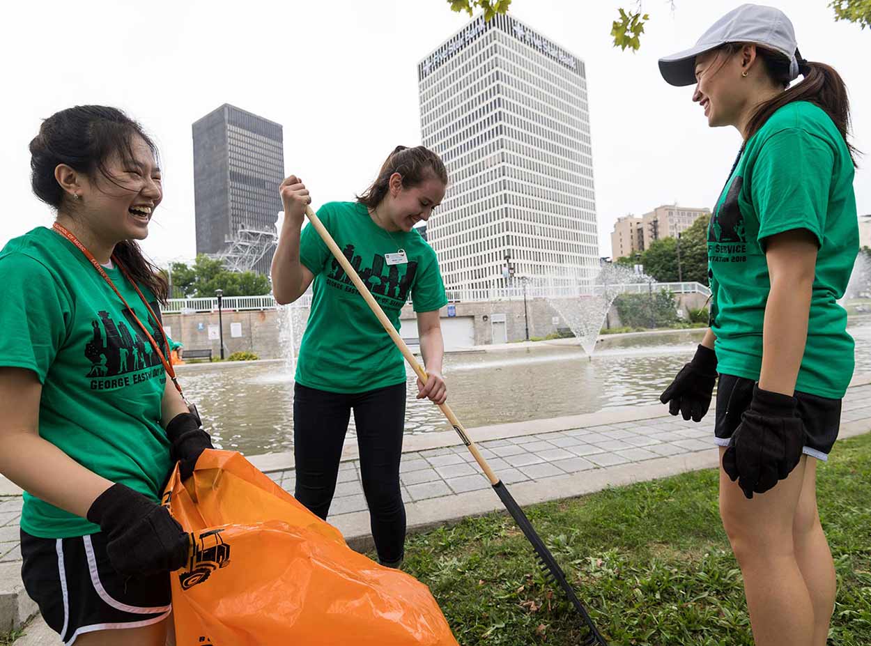 University of Rochester students doing volunteer landscaping work for Wilson Day