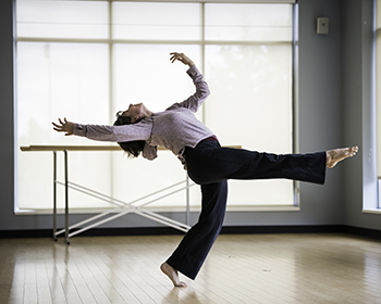 Student dances in a studio