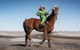 Six-year-old Tamir Munkhbayar is training to become a child jockey