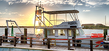 A UTRGV boat on a pier at South Padre Island