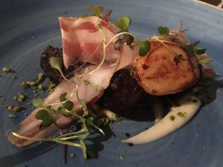 Checked in at Cava Bodega. Scallops with black pudding — with Jessica