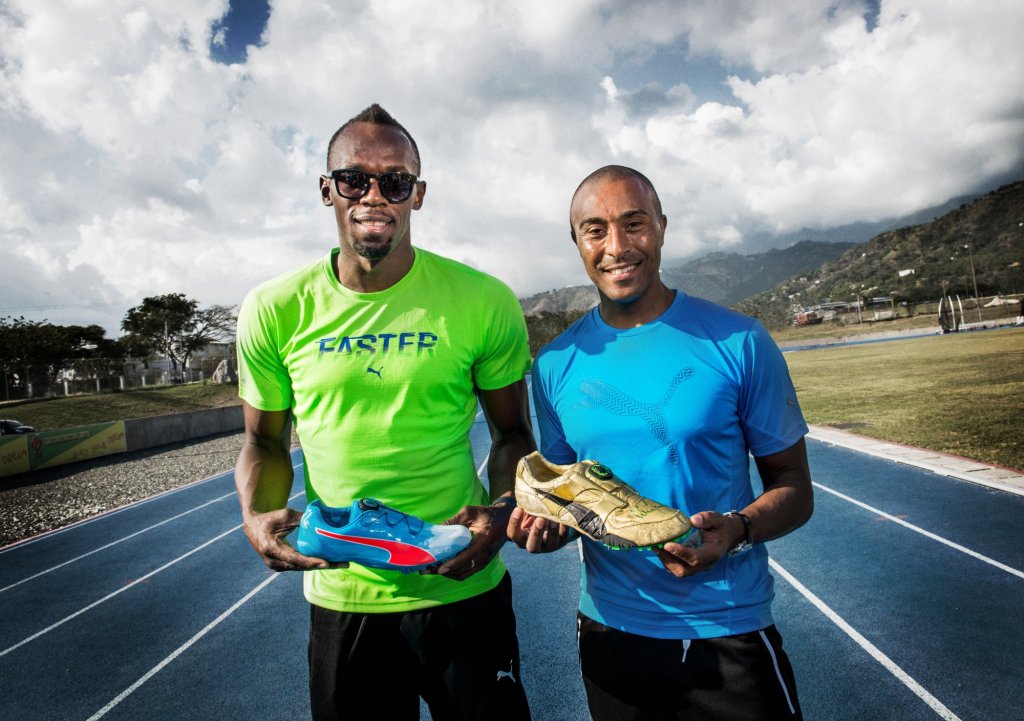 Usain Bolt (trzyma evoSPEED Disc Spike) i Colin Jackson (trzyma swj but Spike z 1993 roku z Mistrzostw wiata)