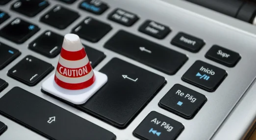 White caution cone on keyboard