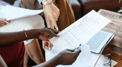 Businesswomen checking information in documents