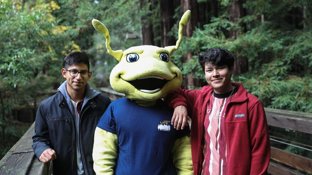 Two students with Sammy the Slug