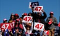 A group of Trump supporters holding signs reading 47.