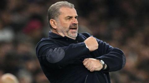 Tottenham manager Ange Postecoglou urges on his players during the Carabao Cup win against Manchester City